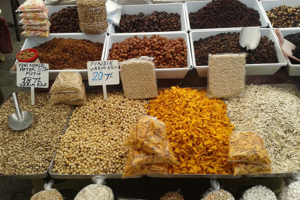 Baskets of nuts and pulses at a market stall