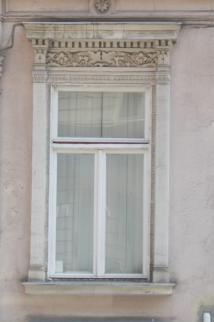 Window on a plain stucco facade
