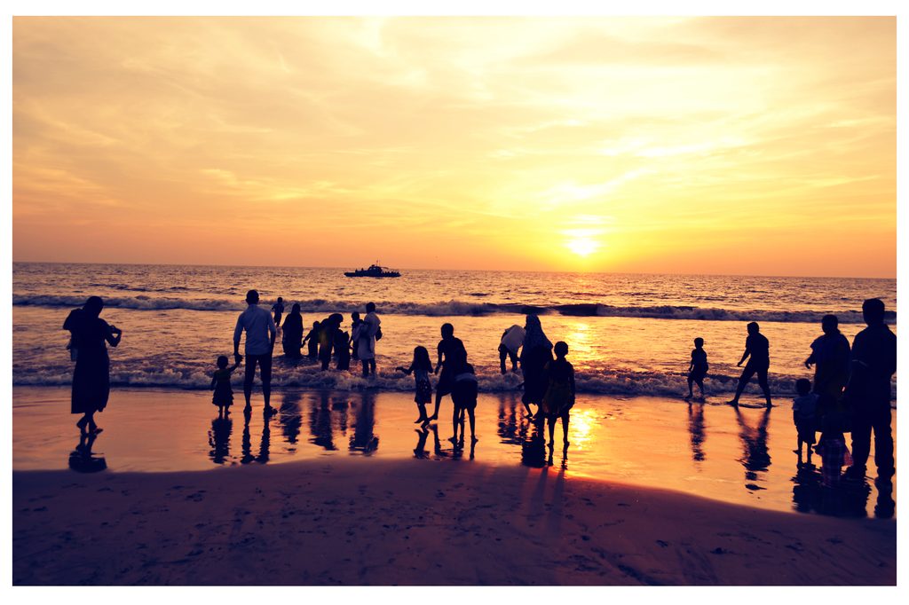 Silhouettes on the beach at sunset