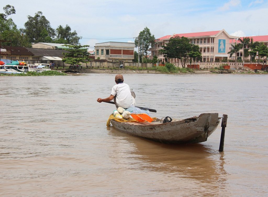 Fisherman rowing a boat