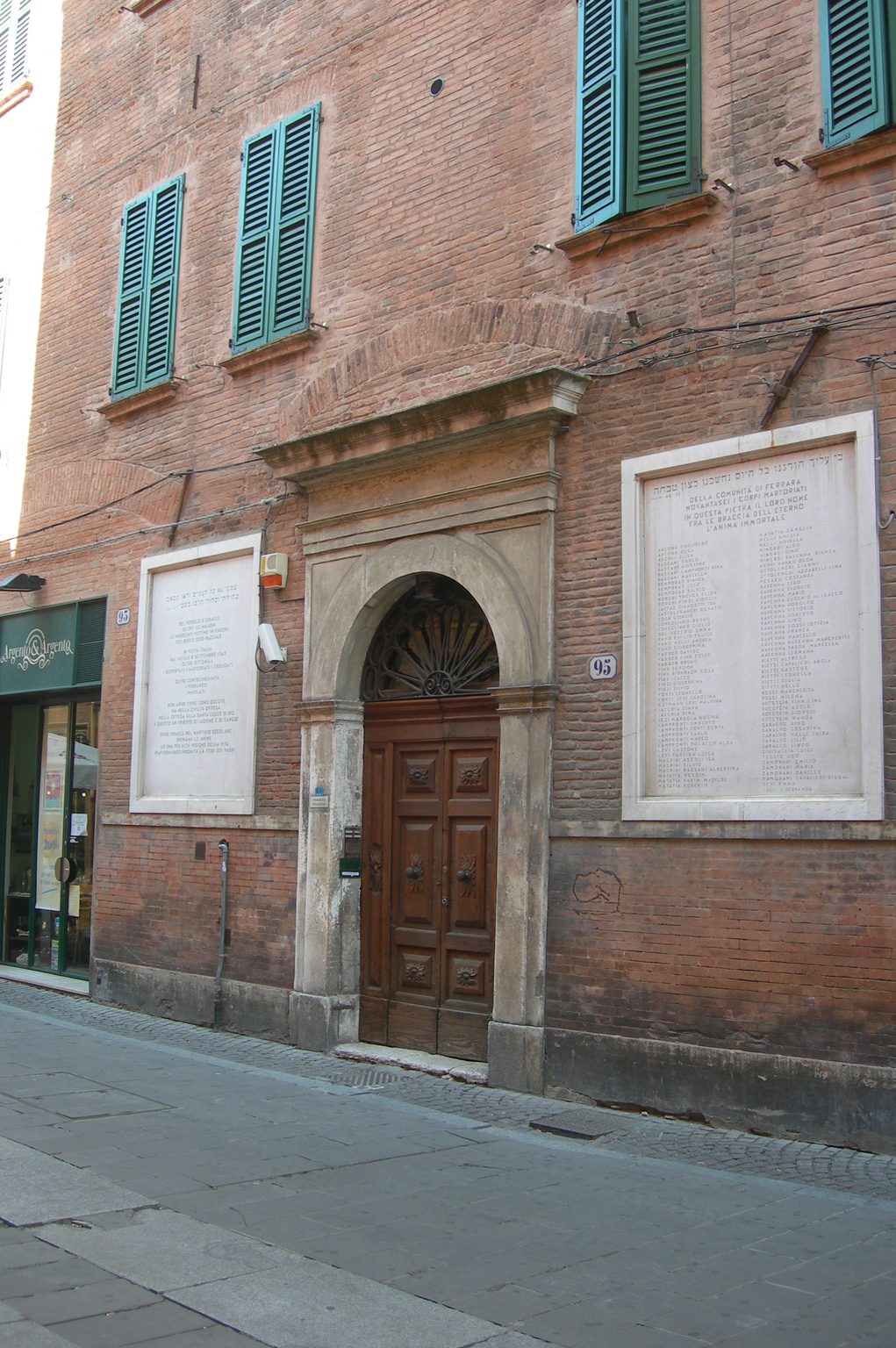 Brick facade with green shutters