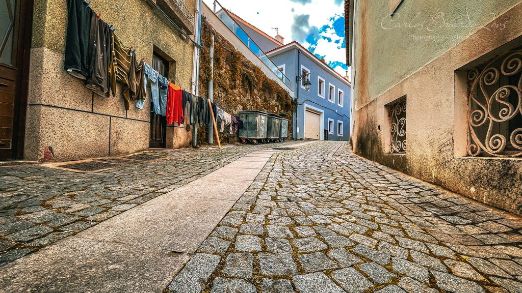 Laundry hung across a narrow street