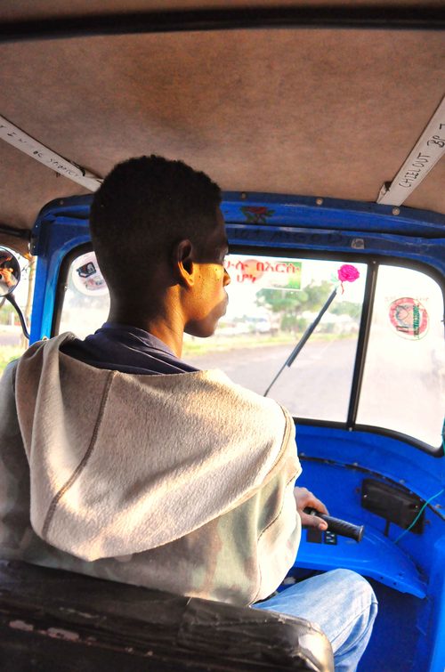 Auto rickshaw driver at the wheel